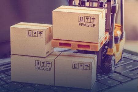 Palletized cartons being moved through a warehouse